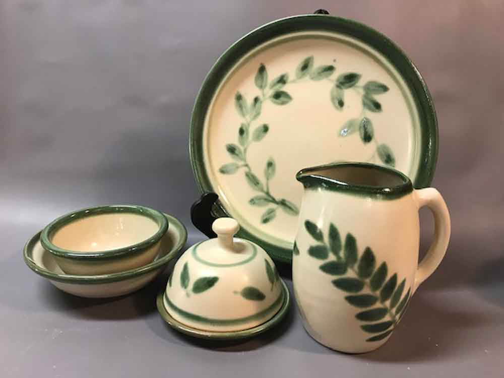 Picture of green decorated pottery by Pamela Quyle